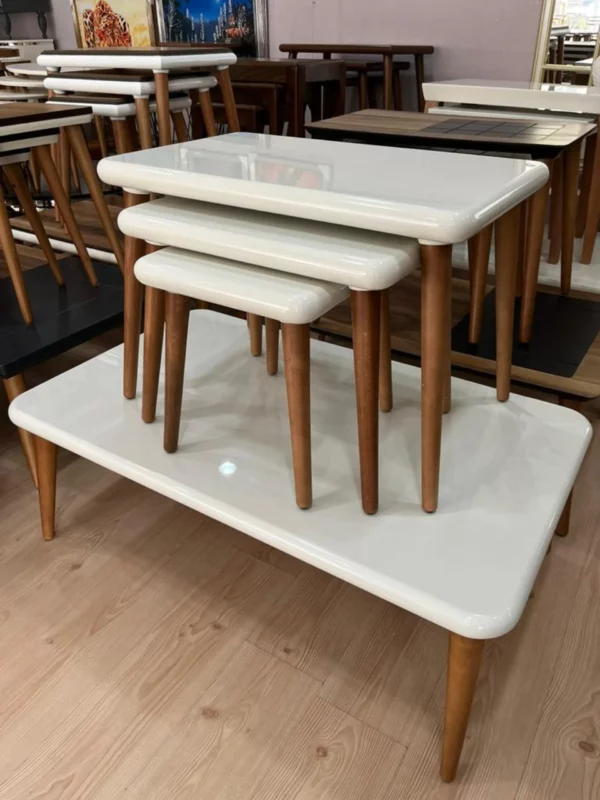 Class Model Coffee Table With Cream Top and Brown Legs